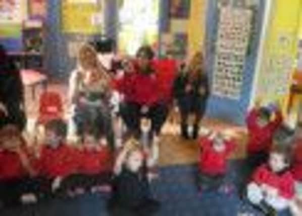 Pre-School parents joining in with nursery rhyme day at Dromore's Jolly Jesters as part of National Nursery Rhyme Week.