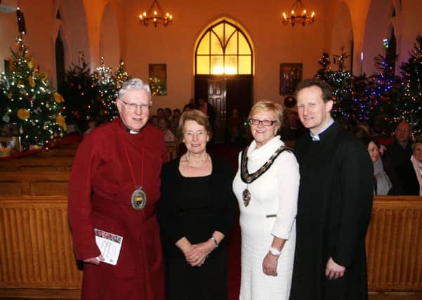Dean John Bond, Sadie Johnston, Mayor of Ballymena, Cllr. Audrey Wales and the Rev. Adrian Halligan at the opening of the St. Patrick's Church Christmas Tree Festival. INBT49-212AC