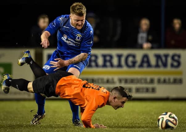 Matt Hazeley and Glenavon's Shane McCabe in action at Dungannon. Pic by Presseye