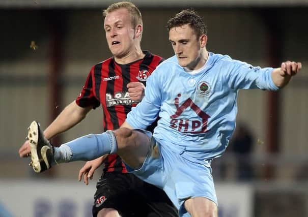 Institute's Stephen O'Donnell tussles with Crusaders striker Jordan Owens.
Picture by Lorcan Doherty/Presseye.com