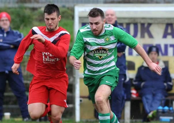 Donegal Celtic's Niall Hawkins and Ballyclare's Samuel McIlveen pictured during Saurday's match at Suffolk Road.