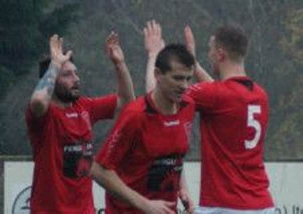 Larne striker Ciaran Murray (left) clebrates his goal against Loughgall. Photo: Andrew Scullion