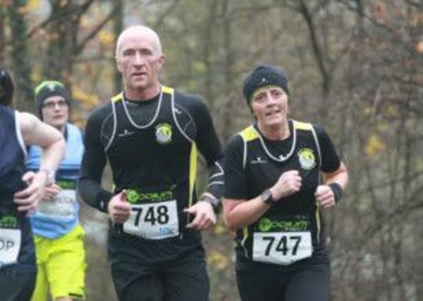 East Coast AC's Drew and Glenda Girvin at the Seeley 10k. INLT 49-904-CON