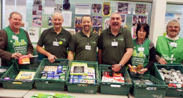SO GENEROUS. Members of the Ballymoney Foodbank, pictured with just some of the many many items donated by kind customers at Tesco on Friday. They are, Walley, Peter, John, Jarlaith, Yvonne and Reggie.INBM49-14 028SC.