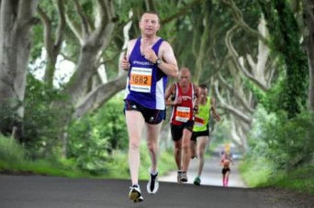 Springwell's Paul Thompson on his way to finishing first local male in the Half Marathon. INBM30-14S