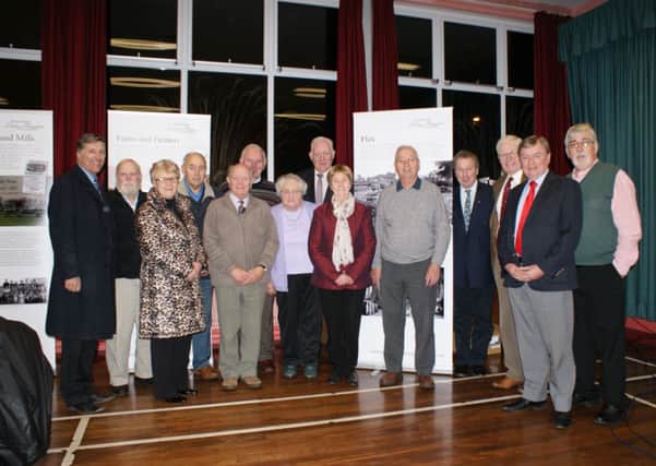 (From left)  Paul Girvan MLA, Leith Burgess, Doagh Ancestry; Vera McWillam, chair GROW; William Stevenson; Canon Wallace Fenton; Tom Andrew; Mary Moore; Brian Duffin (TIDAL); Annie Hill; Derek Lorimer; Danny Kinahan MLA; Billy Robson; Cllr Fraser Agnew, Bob Adams, (Doagh Ancestry) and Doagh interviewees pictured at the launch of "South Antrim Living Memories". INNT 49-471-CON