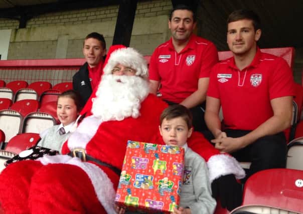 Santa with Peter Hutton, Ryan Curran and Patrick McEleney with young Ellie and Ben Hutton.