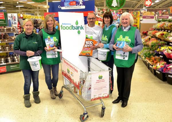 Ronnie McFall from Tesco who was selected to take part in the stores Supermarket Sweep for the Ballymena Foodbank. Included are Foodbank members Mandy Frew (Foodbank Manager), Barbara McKibben, Karen Scott and Janet Coulter. INBT49-260AC