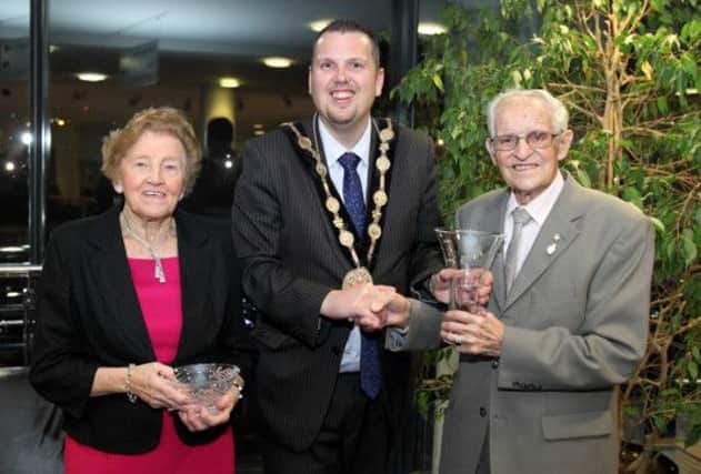 Mayor Andrew Ewing presents Sadie Jess and her husband Tommy Jess, a WW2 veteran, with gifts following a reception at Lisburn civic centre. US1449-507cd  Picture: Cliff Donaldson
