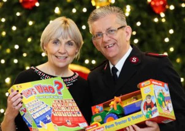 Pictured with Pauline Brown, regional manager, of St Vincent de Paul in Northern Ireland at the launch of the 35th annual "Family Appeal"  is Major Elwyn Harries, leader of the Salvation Army in Ireland. INNT 49-473-CON