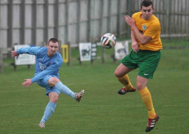 Action from the game between Portstewart and Lurgan Celtic.
