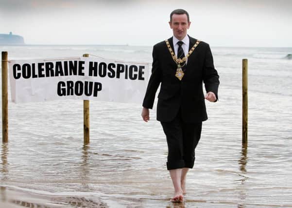 Councillor George Duddy, Mayor of Coleraine, launches the annual Northern Ireland Hospice Christmas Operation Freeze Knees at Portstewart Strand. INCR49-314PL