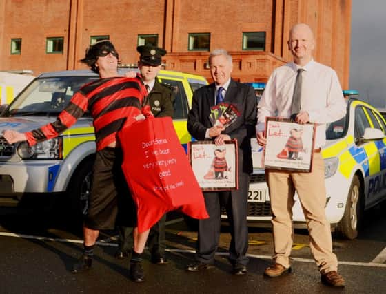 Pictured at the launch of the Christmas Crime Prevention Campaign are: (l-r) Willie Nickit; Chief Inspector John Wilson, Area Commander Lisburn; Councillor Brian Bloomfield, Chairman Lisburn PCSP and Michael Green, PSNI Crime Prevention Officer.