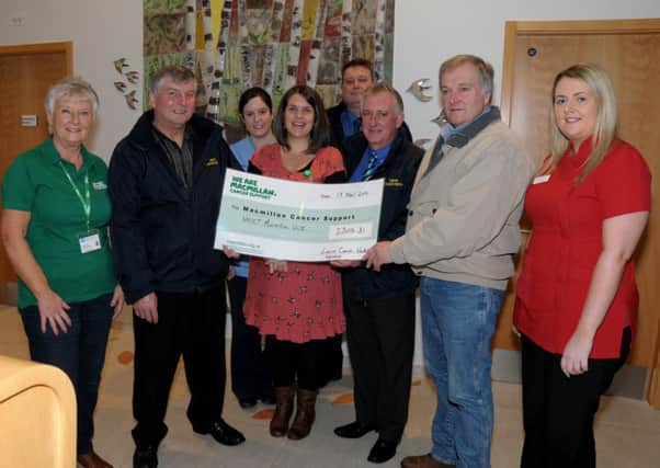 Presenting a cheque for £2305-31p in memory of Morven McConnell to Staff at  Macmillan Cancer Care Unit, Antrim Hospital are workmates from Larne Coachwork,s Alistair Nevin, Danny Rea, Charlie Robinson and Morven's Husband, Les, the money was raised from customers donations and a sponsered slim by Alistair and Danny INLT 48-201-AM