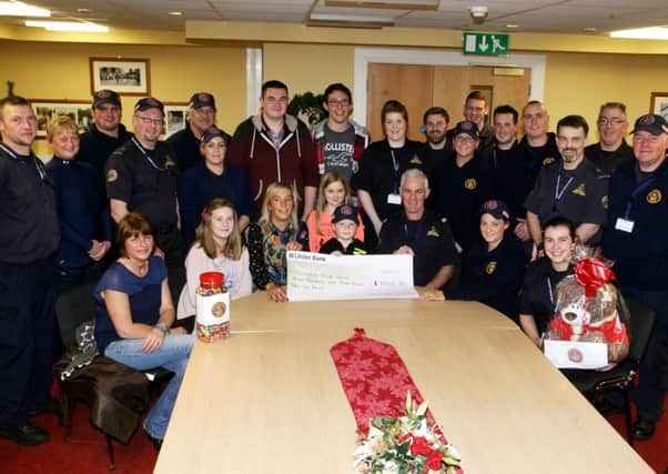 Emma Erwin and friends presents a cheque for £3003.53 to Norman Worthington (Unit Commander) and members of the Community Rescue Service. The money was raised through a recent street collection and other fundraising activities in memory of the late Paul Houston. INBT50-200AC
