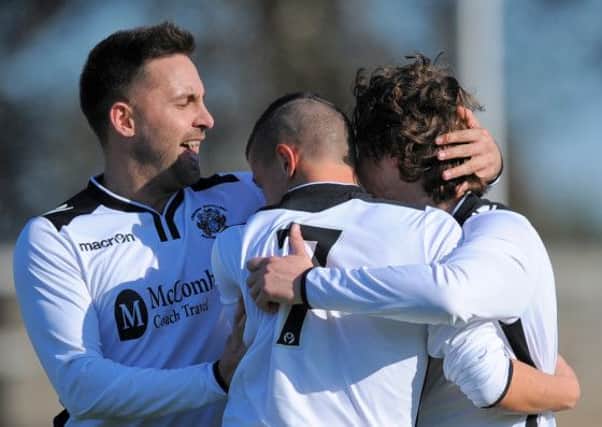 Martin Jones celebrates scoring for Distillery recently. The Whites are on a seven match unbeaten run and are hoping to extend that this weekend against Crumlin Star in the 4th round of the Irish Cup. Pic by Mervyn McClelland Presseye