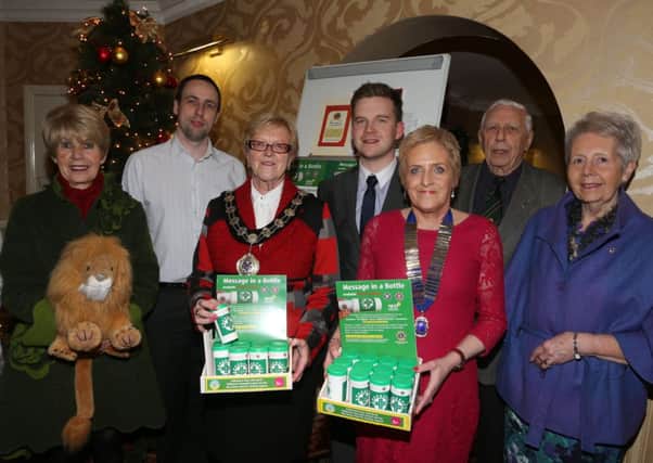 Mayor of Ballymena Cllr Audrey Wales who attended last week's launch of the Lions Club Message in a Bottle scheme in the Adair Arms Hotel is seen here with Ballymena Lions Club president Anne Henry and incoming president Maureen Baw. L-R, Lorraine Evans, Maureen Baw, Ballymena Borough Council Grants Officer Jimmy Healey, Cllr Wales, Darren Galbraith, Anne Henry, Herbie Park, Pam Park. INBT 50-106JC