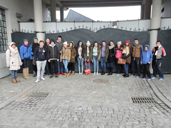 The group from Rasharkin Community Youth Club and Cheers Youth Centre Ballymoney pictured in Krakow outside Schindlers Factory. inbm50-14s