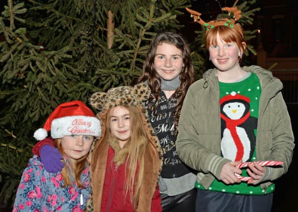 Pictured at the Tullygarley Christmas tree light up are Morgan Beattie with Adele and Nadine Martin and Kaitlin Nelson. INLT 50-020-PSB