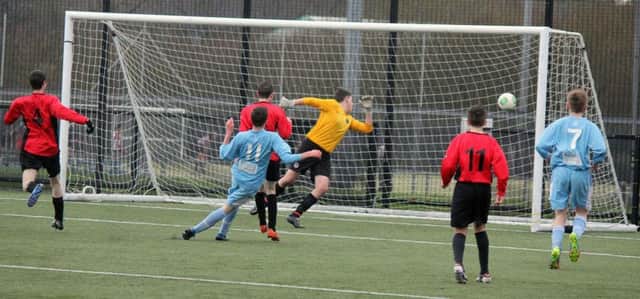Great shot from Ballymena United U-16's player as hewatches it going into the Ballymoor nets. INBT 50-932H