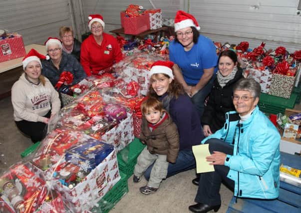 Melanie Gibson, foodbank manager, and her team of the Causeway Vineyard Foodbank pictured with Sheila Palmer of ASDA Coleraine who have made a donation to the Christmas appeal. INCR50-313PL