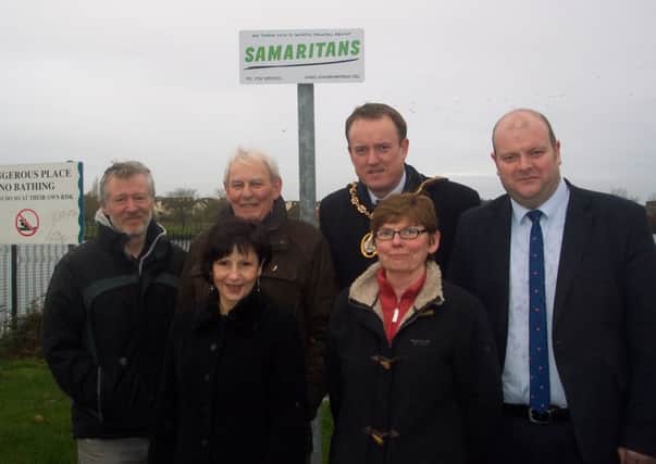 At the launch of new signage for the Samaritans around Craigavon Lakes are from left: Gerard Comac, Trade Signs Lurgan, Drew Boyd Samaritans, Councillor Colin McCusker Mayor of Craigavon, Councillor Mark Baxter, front row, Diane Gowing Samaritans and Beverley Huddleson Samaritans.