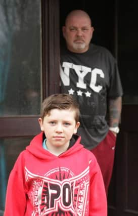 FRIGHTNING.  Mervyn 'Tubes' McIntyre, pictured with his son Logan, who avoided the clutches of a stranger in Carnany estate on Friday.INBM50-14 094SC.