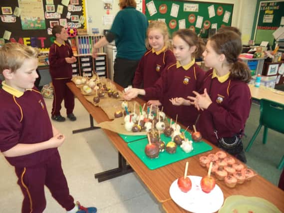 Primary 6 pupils in Edenderry Primary School, Banbridge set up a Young Enterprise company called Scrumptious Surprises and sold toffee and chocolate apples for charity