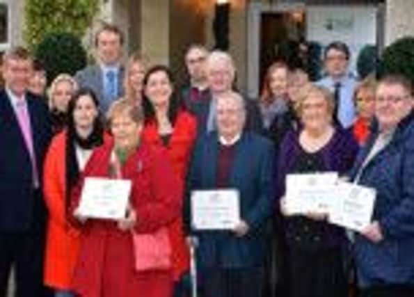 Minister Mervyn Storey (far left) with rural community awards competition winners. INBM50-14S