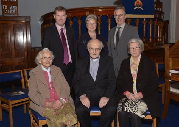 Reverend Jim Gray, seated, pictured at a service held in Faughanvale Presbyterian Church on Sunday morning to celebrate the 50th anniversary of his ordination as a minister. Included are, from left, seated, Mattie Parkhill, the oldest member of the congregation, and Maureen Gray, standing, Reverend Lindsay Blair, Roberta Montgomery and Donald Montgomery, Clerk of Session. INLS4914-188KM