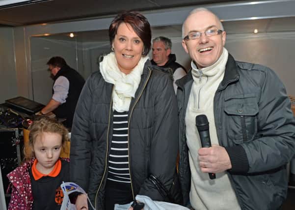 Cheryl and Emily Preshaw are pictured with Frank Mitchell during the U105 Roadshow at Broadway. INLT 50-034-PSB