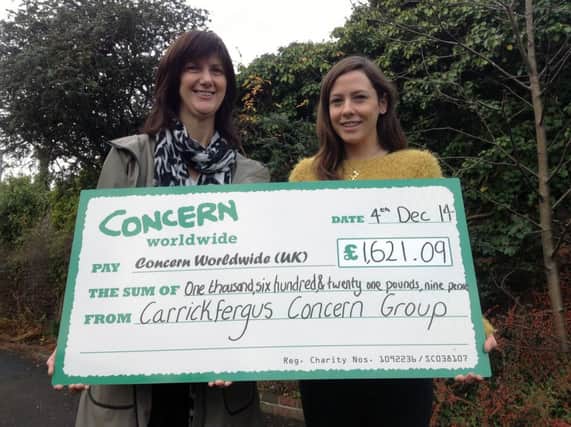 Lisa Wilson (right) from the Concern Worldwide office , Belfast, receiving a cheque from Roberta Cooney, following fundraising efforts by the charity's Carrickfergus support group. INCT 50-755-CON CONCERN