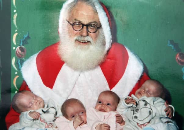Santa (Brian Willis) pictured with the quads; Dean, Ashton, Aimee and Carl. INCR50-300PL