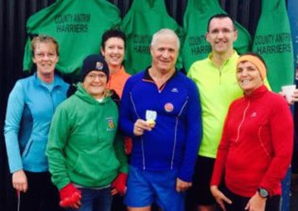 John Purse is congratulated by County Antrim Harriers team-mates after he completed 50 parkruns. INLT 50-917-CON