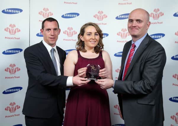 Joan Mallon is pictured with (left) Adrian McInerney, General Manager with award sponsors Samsung Ireland and  Mark Hamilton. INNT-51-701-con