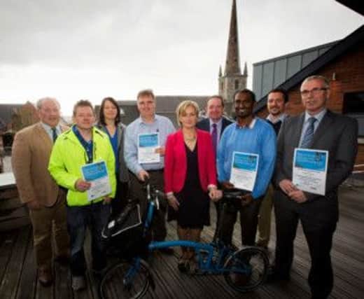 Steven Patterson, from Sustrans on far left and Mabel Scullion, from the Public Health Agency (PHA) in centre with staff of SERC in Lisburn who took part in the project.
