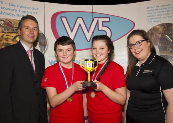 Pupils from Ballyclare High School who won a Consistent Performance Award in the LEGO challenge at Belfast's w5 science and discovery centre. They are pictured with teacher Dr Paul Wilson and team mentor Niamh OHare from Caterpillar NI.