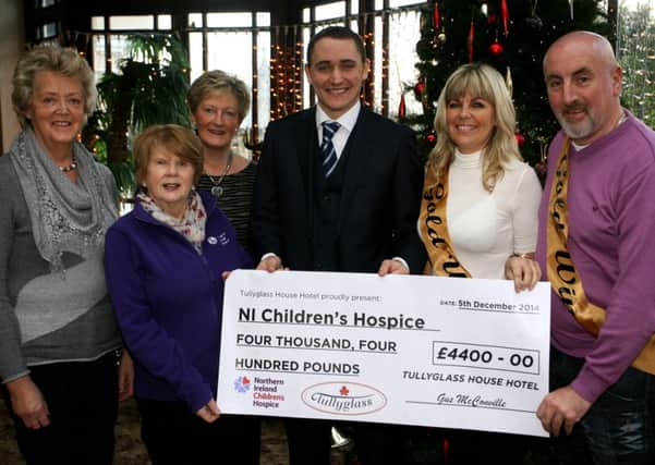 Samina Bonar, Heather Montgomery and Mural Bar from the Ballymena Hospice Support Group, are pictured receiving a cheque for £4400 from Gus McConville, manager of the Tullyglass House Hotel, and Hester Glenn and Gerard Foley (first prize winners in the competition receiving flights and luxury accommodation to Nashville), proceeds from the hotels recent "Jive Factor"competition. The Tullyglass would like to thank all the dancers who particiapted in the final. The event was a huge success and raised a massive amount for the chairty. A special thanks must go to competer Hugo Duncan, band Richie Remo and all the patrons and voters who supported the evening. INBT51-203AC