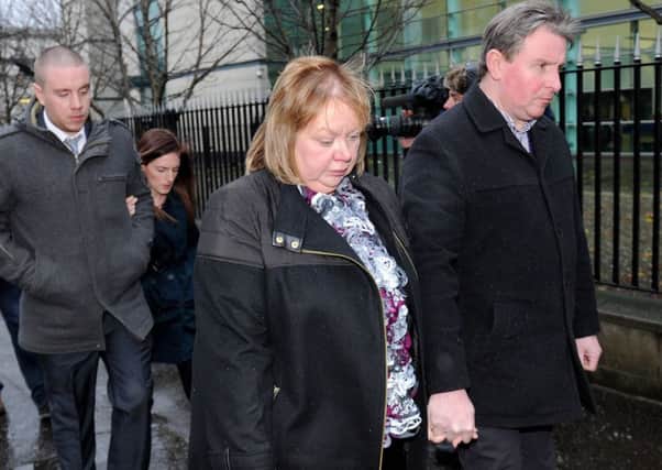 Members of 
Bertie Acheson's family leave Laganside Court in Belfast after the sentencing hearing