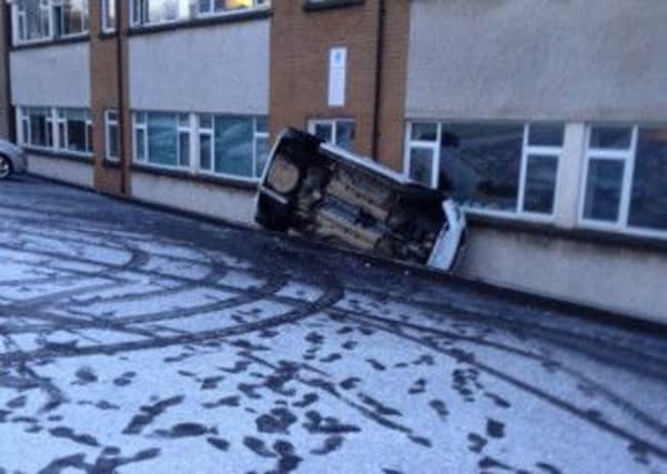 Drivers had to endure treacherous road conditions this morning as this overturned car shows. (s)
