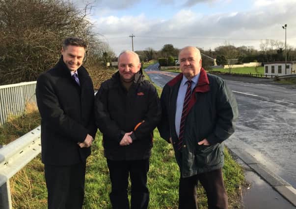 DUP colleagues Paul Frew MLA, Mid & East Antrim Councillor Reuben Glover and Ballymena Borough Councillors, Ald. Martin Clarke pictured along the stretch of road at Crebilly which is to be resurfaced.