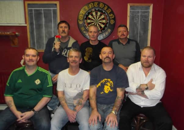 Well done to the 'Corinthians Darts Team' from the North West Dart League, who have helped raise almost £3,000 for the children's ward at Altnagelvin. Back row (left to right) Jimmy Dean, Raymond Campbell, Neil Bronze; and front Row (left to right) Davy Kee, Derek Leonard, Keith Moore, Austin McClay, sporting - by their own admission - some pretty atrocious moustaches during 'Movember.'