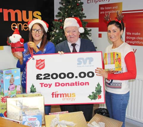 Rasharkin locals Karly McCotter and Emma Crawford from firmus energy joined Cormac Wilson, Senior Regional Vice President of St Vincent de Paul (SVP) to help handover £2000 worth of toys from the natural gas company to the Christmas Family Appeal, which is also organised in conjunction with the Salvation Army. inbm51-14