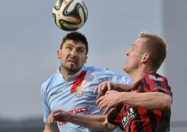 Ballymena United defender Davy Munster in action with Crusaders' Jordan Owens. Picture: Press Eye.