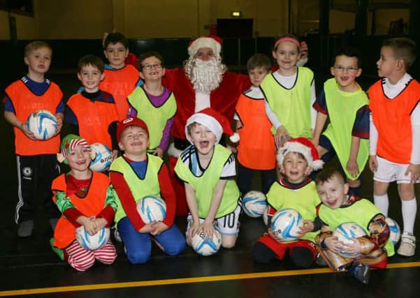 Members of the Northend Youth Football Development Centre at their recent Christmas fancy dress training session. INBT51-281AC
