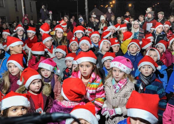 A sea of Santa hats at the switching on of the Coagh Christmas lights.