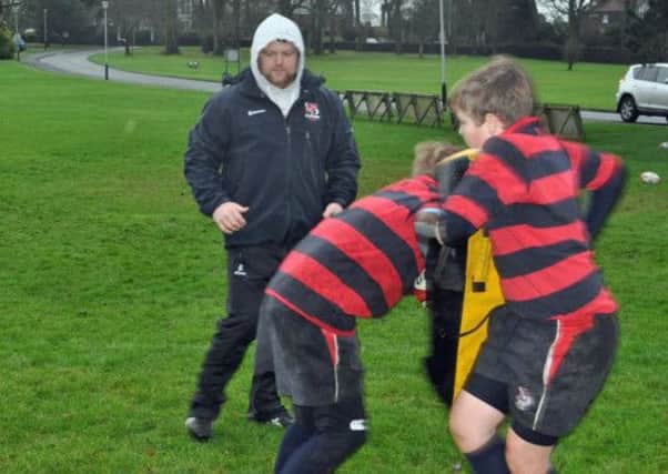 Ulster player Andy Warwick puts Ballymena Academy's Year 8 players through their paces.