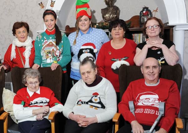 Residents and staff from Drapersfield House Private Nursing Home, who took part in the Christmas Jumper Day  held at the Home in aid of Charis Integrated Cancer Care.