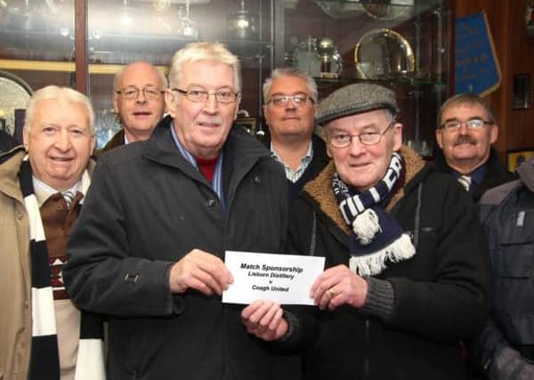 The Grosvenor Whites Supporters' Club (GWSC) sponsored the Lisburn Distillery game against Coagh United. Francie Parkinson (centre right) presented a sponsorship cheque to Lisburn Distillery chairman Jim Greer with fellow members of the GWSC present. Picture - David Hunter.