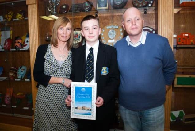 Carrickfergus College pupil Ryan McFarland with his proud parents. INCT 51-706-CON POEM